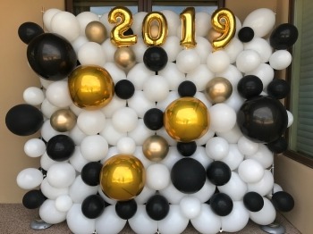 Black, white and gold balloon wall with foil numbers by AZ Party Mart