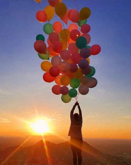 Colorful balloon release bouquet by AZ Party Mart