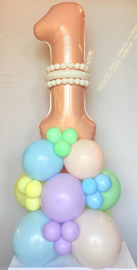 Rose-gold number one balloon on a pastel organic base by AZ Party Mart