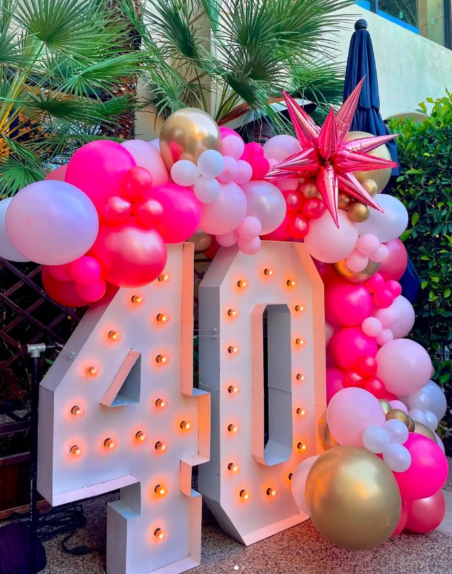 Organic balloon garland installation by AZ Party Mart