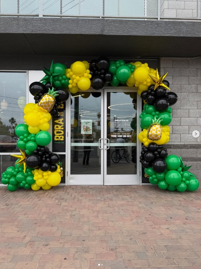 Organic balloon garland installation by AZ Party Mart