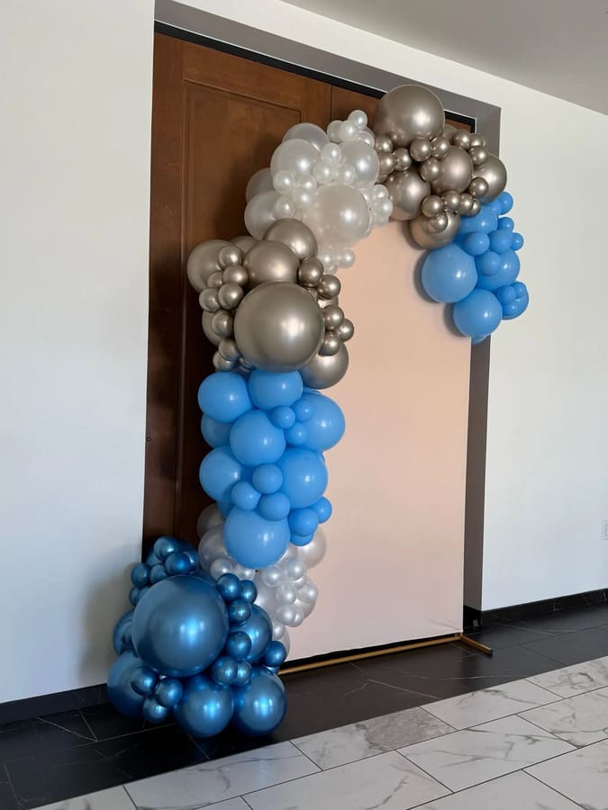 Organic balloon garland installation by AZ Party Mart