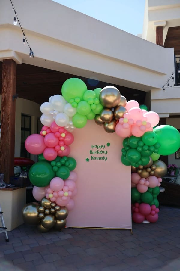 Organic balloon garland installation by AZ Party Mart