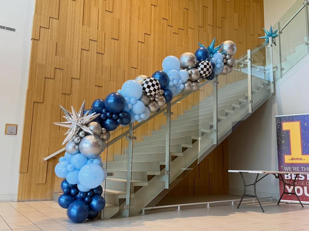 Organic balloon garland installation by AZ Party Mart