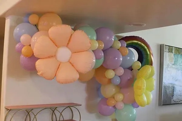 Organic balloon garland installation by AZ Party Mart