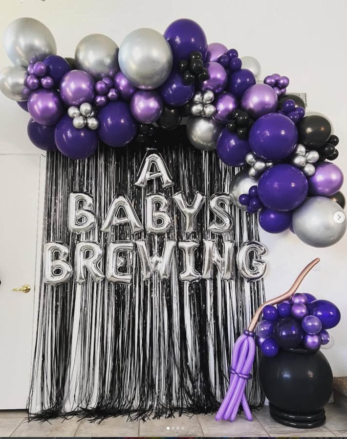 Purple and silver baby shower garland with a fringe backdrop by AZ Party Mart
