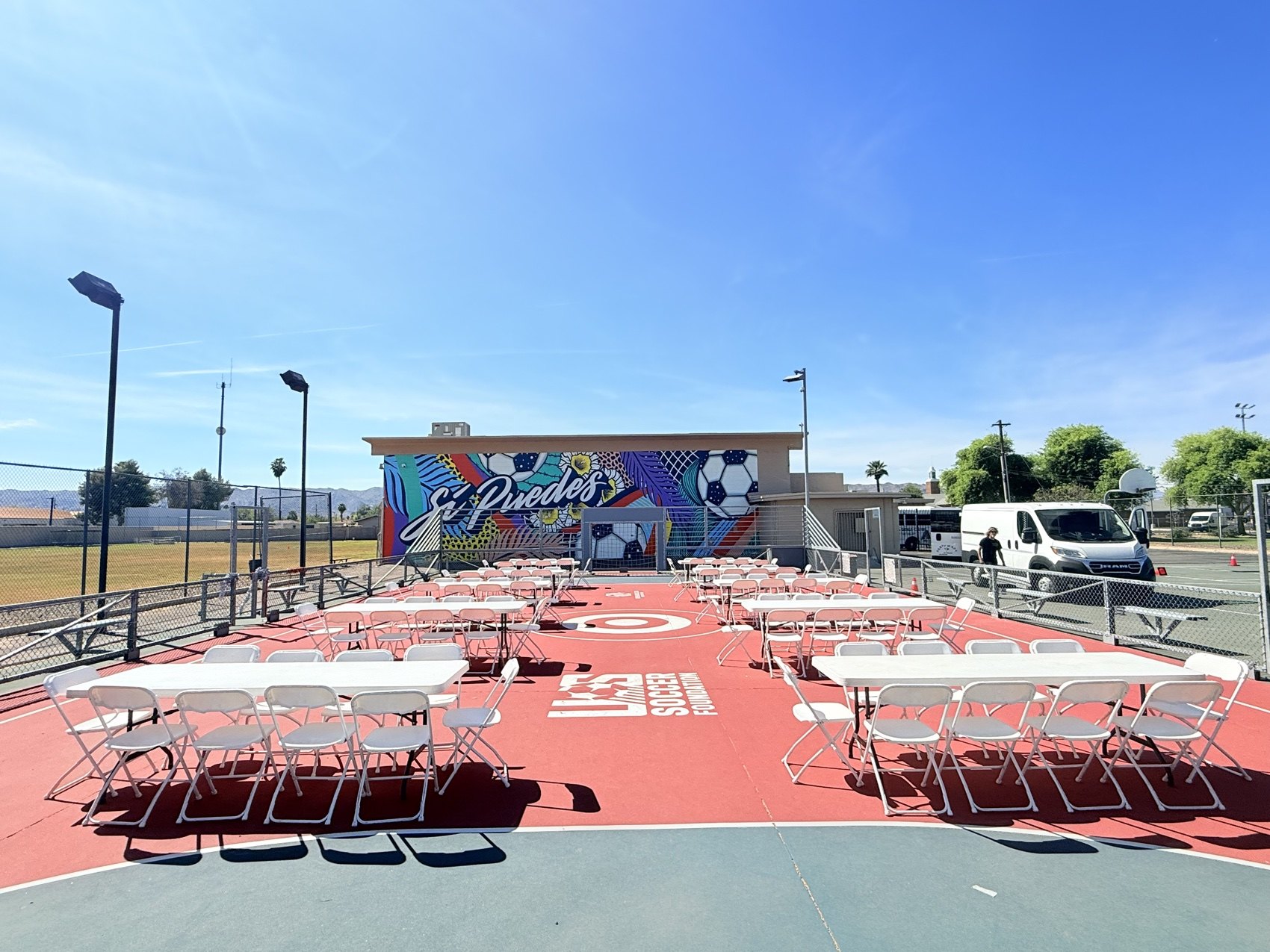 Rows of rental tables and chairs set up for an event